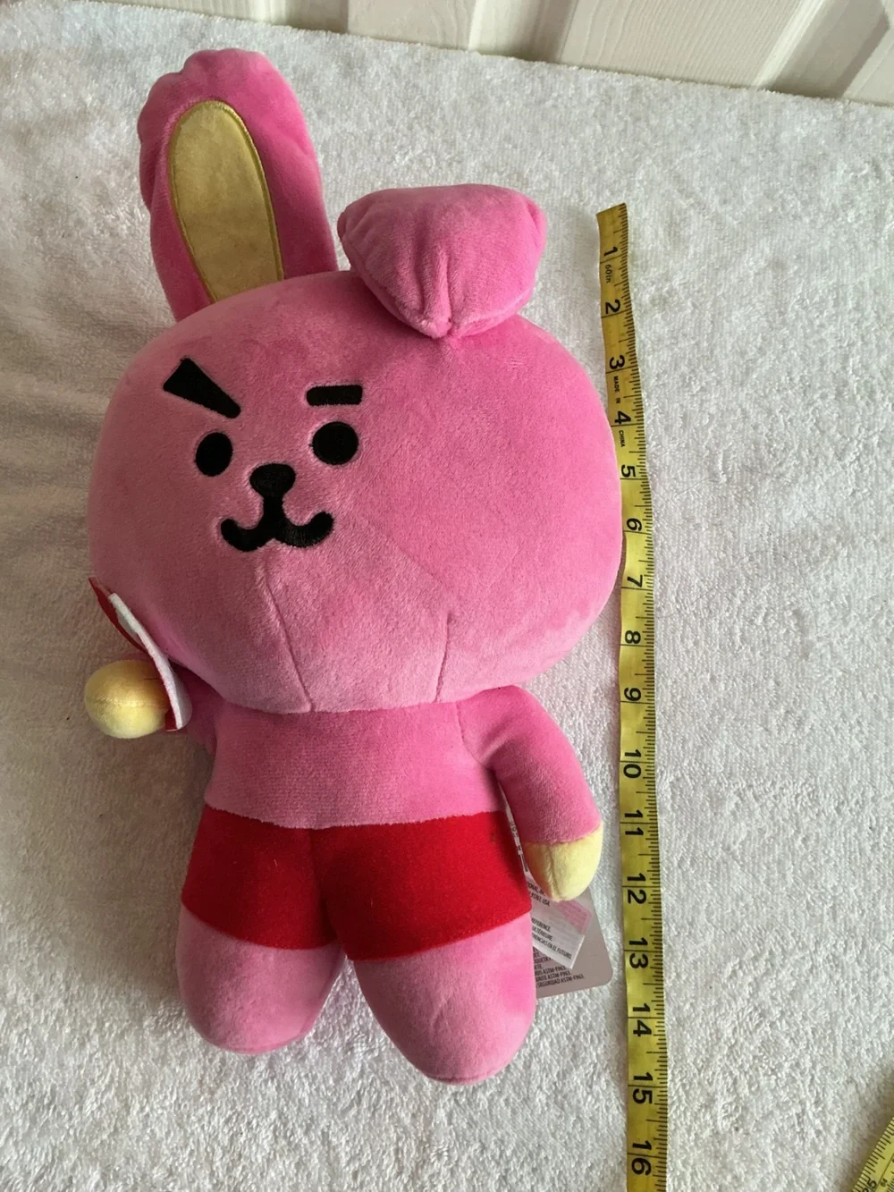 Bright Pink Plush Bunny Character Toy with Red Shorts